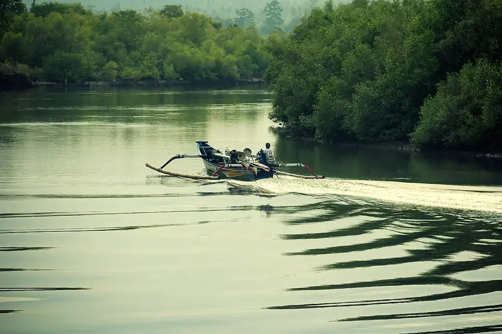 A harbour full of colourful jukung boats — Pantai Perancak, Where to ride from Negara